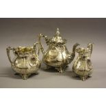 A VICTORIAN THREE PIECE SILVER TEASET, of pear shape, foliate scroll engraved decoration, maker R.T,
