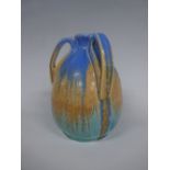 A RUSKIN POTTERY TYG, of ovoid form having orange central band to tonal blue crystaline glaze,