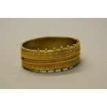 A LATE VICTORIAN GOLD CUFF BANGLE, circa 1880, the hinged top with Etruscan style wirework and