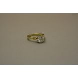 A LATE 20TH CENTURY YELLOW GOLD SINGLE STONE DIAMOND RING, one modern round brilliant cut diamond