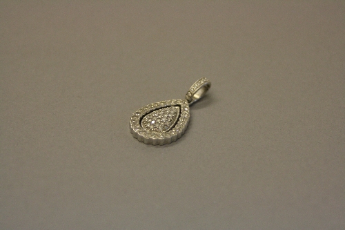 A MODERN 9CT WHITE GOLD AND DIAMOND PEAR SHAPE DROP PENDANT, measuring approximately 30mm in