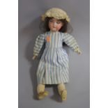 AN ARMAND MARSEILLE BISQUE HEAD DOLL, nape of neck marked 'Armand Marseille, Made in Germany, 390,