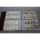 CIGARETTE CARDS, two modern binders of Players cigarette cards, titles include Dogs, Polar