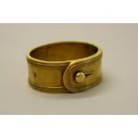 A LATE VICTORIAN GOLD HINGED CUFF BANGLE, circa 1880, designed as a belt buckle, measuring