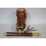 A BRASS AND LEATHER TELESCOPE, (a.f), together with a pair of brass and leather binoculars, a
