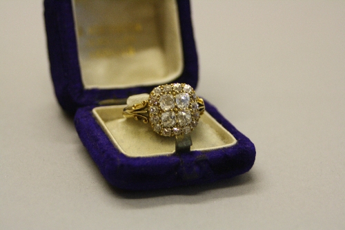 A LATE VICTORIAN DIAMOND CUSHION SHAPE CLUSTER RING, head measuring approximately 13.5mm in diameter