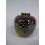 A RUSKIN POTTERY POT POURRI VASE, of ovoid form having four pierced roundels to upper body, brown