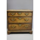 A 19TH CENTURY OAK CROSSBANDED MAHOGANY CHEST OF DRAWERS, having three graduated long drawers, all