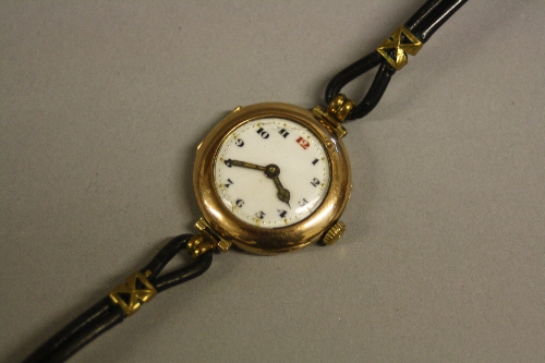 A LADIES 9CT ROLEX CASED STRAP WATCH, 15 jewelled movement, case No.599542 c.1920 (working)