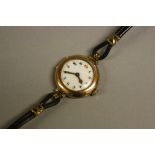 A LADIES 9CT ROLEX CASED STRAP WATCH, 15 jewelled movement, case No.599542 c.1920 (working)