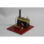 AN UNMARKED LIVE STEAM ENGINE, not tested, mounted on tinplate plinth