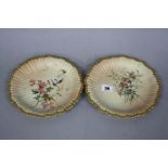 A PAIR OF ROYAL WORCESTER BLUSH IVORY DESSERT PLATES, of wavy circular form, one printed and painted