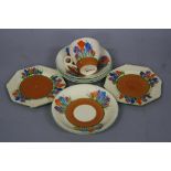 A CLARICE CLIFF BIZARRE CROCUS PATTERN PART TEASET, comprising a cup, four saucers diameters