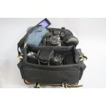 A CAMERA BAG, containing a Minolta Dynax 700si SLR camera fitted with a 28-80mm 1:4 lens, a