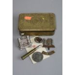 A WW1 CHRISTMAS 1914 PRINCESS MARY TIN, containing 2 Iniskilling Cap devices an Iniskilling