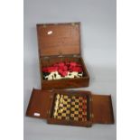 A SET OF LATE 19TH CENTURY BONE CHESS MEN, stained red, carved decoration (s.d.), height max