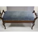 AN EARLY 20TH CENTURY MAHOGANY DUET STOOL, turned handles to either end, blue velvet cover seat,