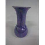 A RUSKIN POTTERY VASE, of swollen ovoid form with long flared neck, everted rim, having lilac lustre