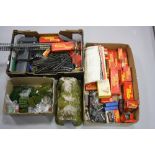 A QUANTITY OF BOXED AND UNBOXED OO GAUGE MODEL RAILWAY ITEMS, to include boxed Tri-ang saddle