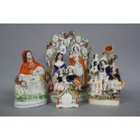 FOUR VICTORIAN STAFFORDSHIRE POTTERY FIGURES, comprising Little Red Riding Hood, clock face group,