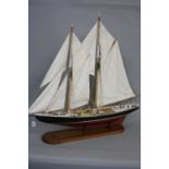 A MODERN WOODEN MODEL OF 'BLUENOSE', a Canadian fishing and racing schooner originally built in