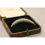 A LATE 19TH CENTURY OPAL AND DIAMOND CRESCENT BROOCH, measuring approximately 61mm in length, a