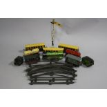A QUANTITY OF UNBOXED TINPLATE O GAUGE CLOCKWORK CHAD VALLEY MODEL RAILWAY ITEMS, locomotive and