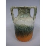 A RUSKIN POTTERY TYG, of ovoid form having green, white and orange crystalline glaze, impressed