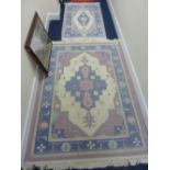 A LILAC AND BLUE GROUND RUG, approximate size 190cm x 150cm and a similar larger rug (2)