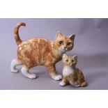 TWO SIGNED WINSTANLEY GINGER CATS, one walking, length approximately 25cm x height 22cm, smaller