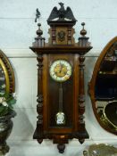 A VICTORIAN WALNUT CASED WALL CLOCK (key and pendulum)