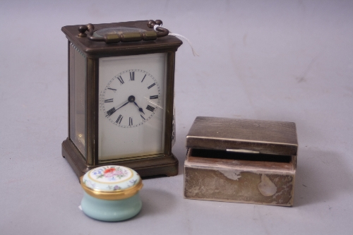 AN 20TH CENTURY BRASS CASED CARRIAGE CLOCK, enamel dial, Roman numerals, with key, height
