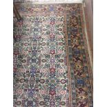 A LARGE MULTI-COLOURED CARPET, approximate size 355cm x 250cm, 'Persian Carpet' label to underside