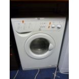 AN INDESIT WASHING MACHINE