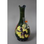 A DISTRESSED MOORCROFT POTTERY VASE, Hibiscus pattern on green ground, paper label to base and