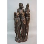 TRIBAL INTEREST, a carved hardwood figure group of an African male, female and four children, height