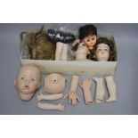 A QUANTITY OF CREATIONS PAST AND OTHER REPRODUCTION DOLL PARTS, heads, limbs, wigs etc (two boxes)
