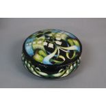 A MOORCROFT KALI ZOE PATTERN POWDER BOWL AND COVER, of circular form, bears blue cross mark in