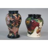 A MOORCROFT ANNA LILY PATTERN BALUSTER VASE, height approximately 8cm, bears price sticker,