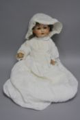 A BISQUE HEAD DOLL, nape of neck marked 'Germany 971 A CM D.R.G.M. 267', with two holes in back of