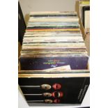 A BOX OF L.P'S AND SINGLES, including Queen, Genesis, Magna Carta, The Beatles etc