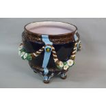 A VICTORIAN MAJOLICA POTTERY JARDINIERE, of urn form, pink glazed interior, the exterior moulded