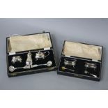 A CASED PAIR OF GEORGE VI WALKER & HALL SILVER SALTS, shaped rectangular form, on four cabriole