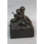 AN EARLY 19TH CENTURY BRONZE OF TWO CHERUBS EMBRACING, seated before a tree stump, a pair of doves