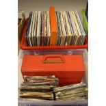 A BOX OF L.P'S AND A BOX OF SINGLES, over 80 L.P's including Nat King Cole, Queen, Elvis Presley,