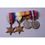 A WWII GROUP OF FOUR MEDALS, namely 1939-45 Star, Atlantic Star, Defence and War Medal un-named as