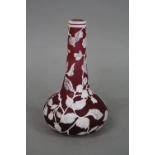 A CONTEMPORARY CAMEO GLASS VASE, having squat globular body and tapering long neck, ruby glass