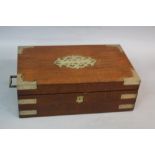 A VICTORIAN WALNUT AND BRASS BOUND WRITING SLOPE, the interior fitted with one ink well and