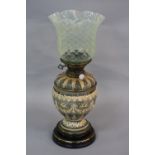 A LATE VICTORIAN OIL LAMP, trellis pattern vaseline glass shade with wavy rim, the ovoid grey/blue