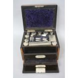 A MID VICTORIAN WALNUT AND EBONY STRUNG TOILET BOX, the hinged lid opening to reveal a fitted